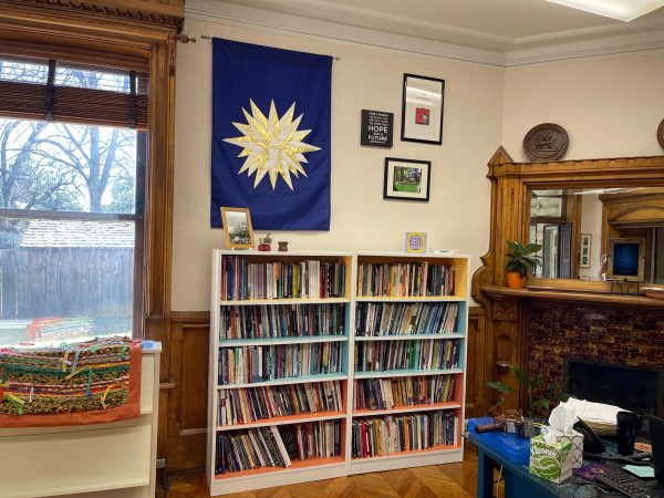 Colorful book shelves and a blue banner with a Moravian Star