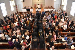 over-view of graduation ceremony inside church
