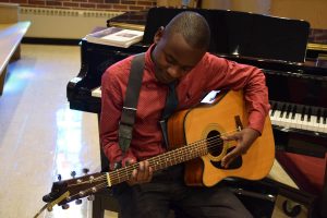 musician with guitar and piano