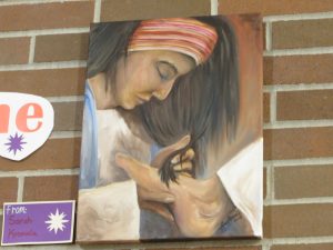 painting of woman washing Jesus feet with her hair