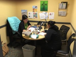 2 women sitting at desk
