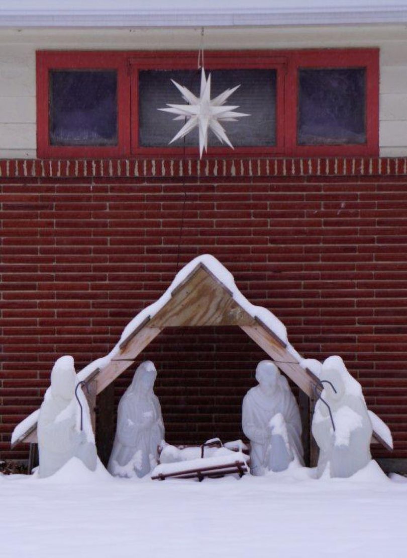 Nativity scene outside church in winter