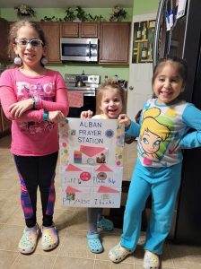 young children with prayer station