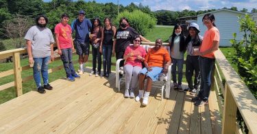 people standing on new deck