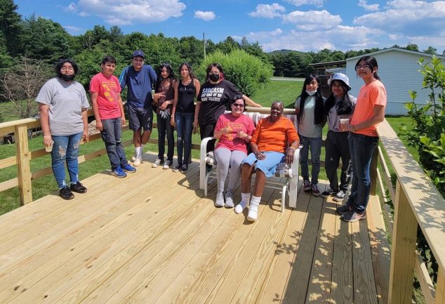 people standing on new deck