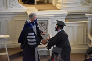Image of graduate receiving diploma