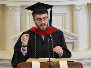 Seminary graduate making speech