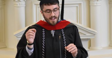 Seminary graduate making speech