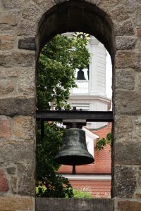 Church bell between arches