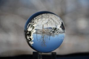 Winter scene depicted through a crystal ball