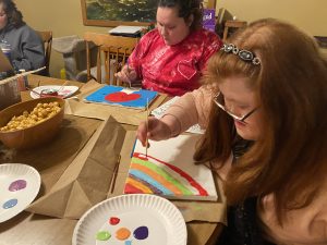 children/adults painting pictures